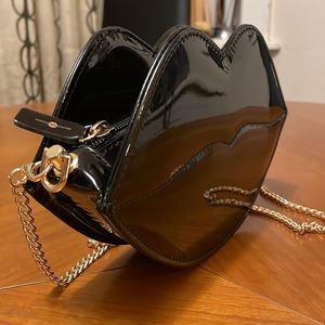 Secret Kisses black lip shaped purse, new without tags